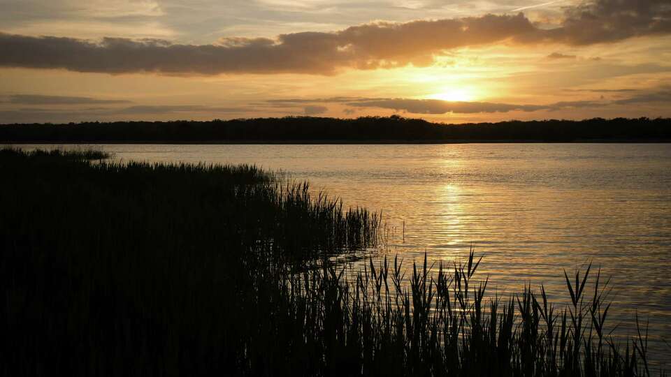 The sun sets Wednesday March 22, 2023, at Fairfield Lake State Park in Fairfield.