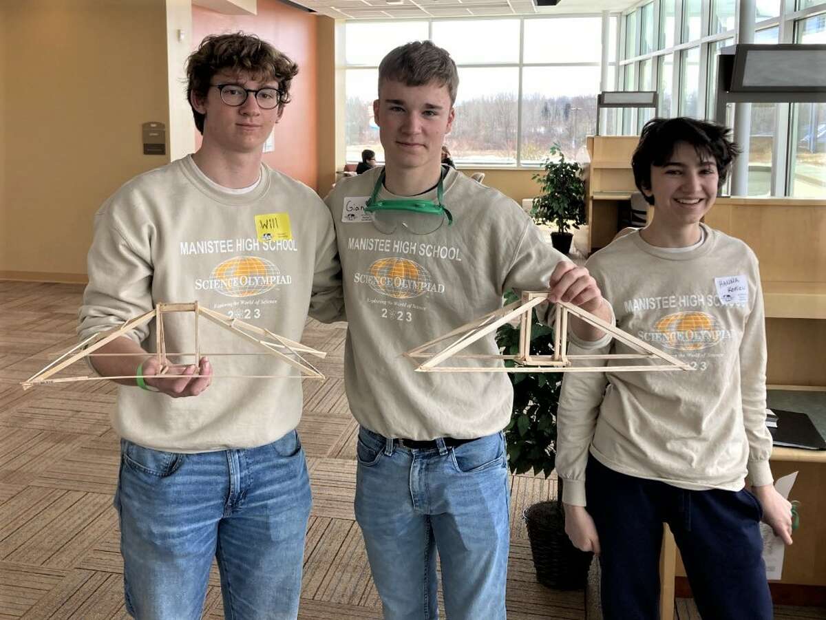 Manistee High School Science Olympiad teammates Will Somsel (left), Johannes Reuting and Hanna Konen pose for a photo March 18 at Mid Michigan College in Mount Pleasant.