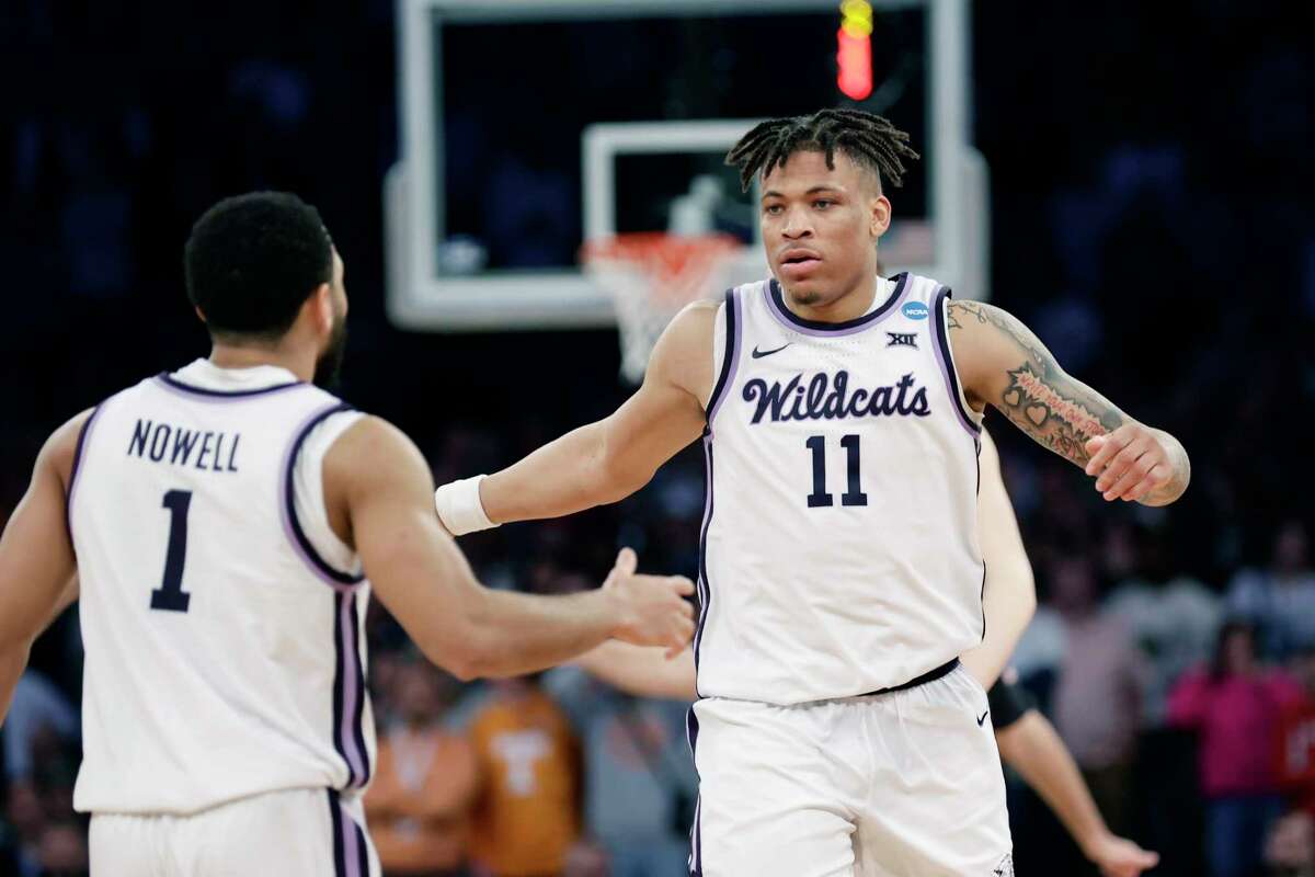 Kansas State forward Keyontae Johnson (11) is greeted by guard Markquis Nowell (1) after a play in overtime of a Sweet 16 college basketball game against Michigan State in the East Regional of the NCAA tournament at Madison Square Garden, Thursday, March 23, 2023, in New York.