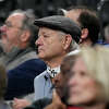 Actor Bill Murray, middle, attends a Sweet 16 college basketball game between UConn and Arkansas in the West Regional of the NCAA Tournament, Thursday, March 23, 2023, in Las Vegas. (AP Photo/John Locher)