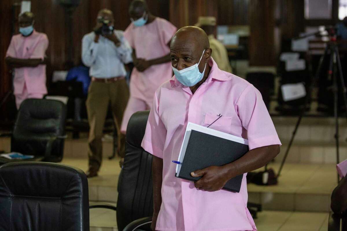 FILE - Paul Rusesabagina, who inspired the film "Hotel Rwanda" and is credited with saving more than 1,000 people by sheltering them at the hotel he managed during the genocide, attends a court hearing in Kigali, Rwanda, Friday Feb. 26, 2021. Rwanda's government has commuted the sentence of Paul Rusesabagina was convicted of terrorism offenses years later in a widely criticized trial. Government spokeswoman Yolande Makolo told The Associated Press on Friday, March 24, 2023, that the 25-year sentence was commuted by presidential order after a request for clemency.