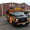A bus leaves Church Street School in Hamden after dropping off children in the morning on March 24, 2023.