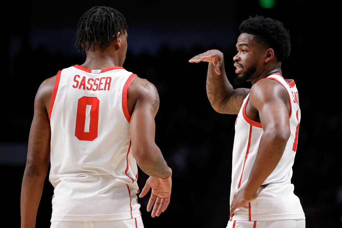 Marcus Sasser #0 and Jamal Shead #1 of the Houston Cougars talk on the court during the first half against the Auburn Tigers in the second round of the NCAA Men's Basketball Tournament at Legacy Arena at the BJCC on March 18, 2023 in Birmingham, Alabama.