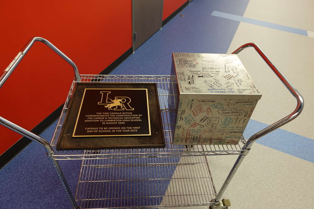 The time capsule and commemorative plaque before they were placed into the wall of Lumberton High School's new Career and Technical Education building. Photo taken March 23, 2023. Photo by Olivia Malick/ The Enterprise
