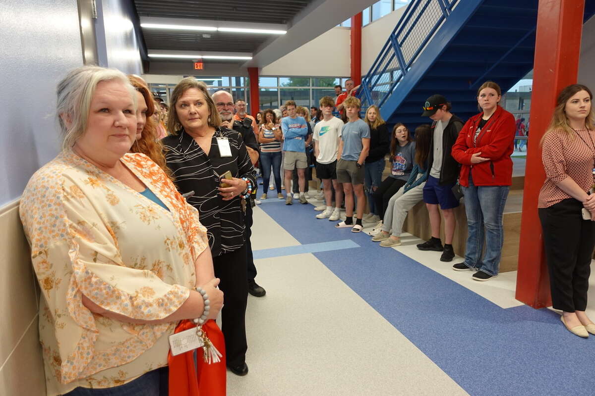 Dozens of Lumberton ISD faculty, staff, administrators, students and community members gather to watch the time capsule be placed into the wall of the high school's new Career and Technical Education Building. Photo taken March 23, 2023. Photo by Olivia Malick/ The Enterprise