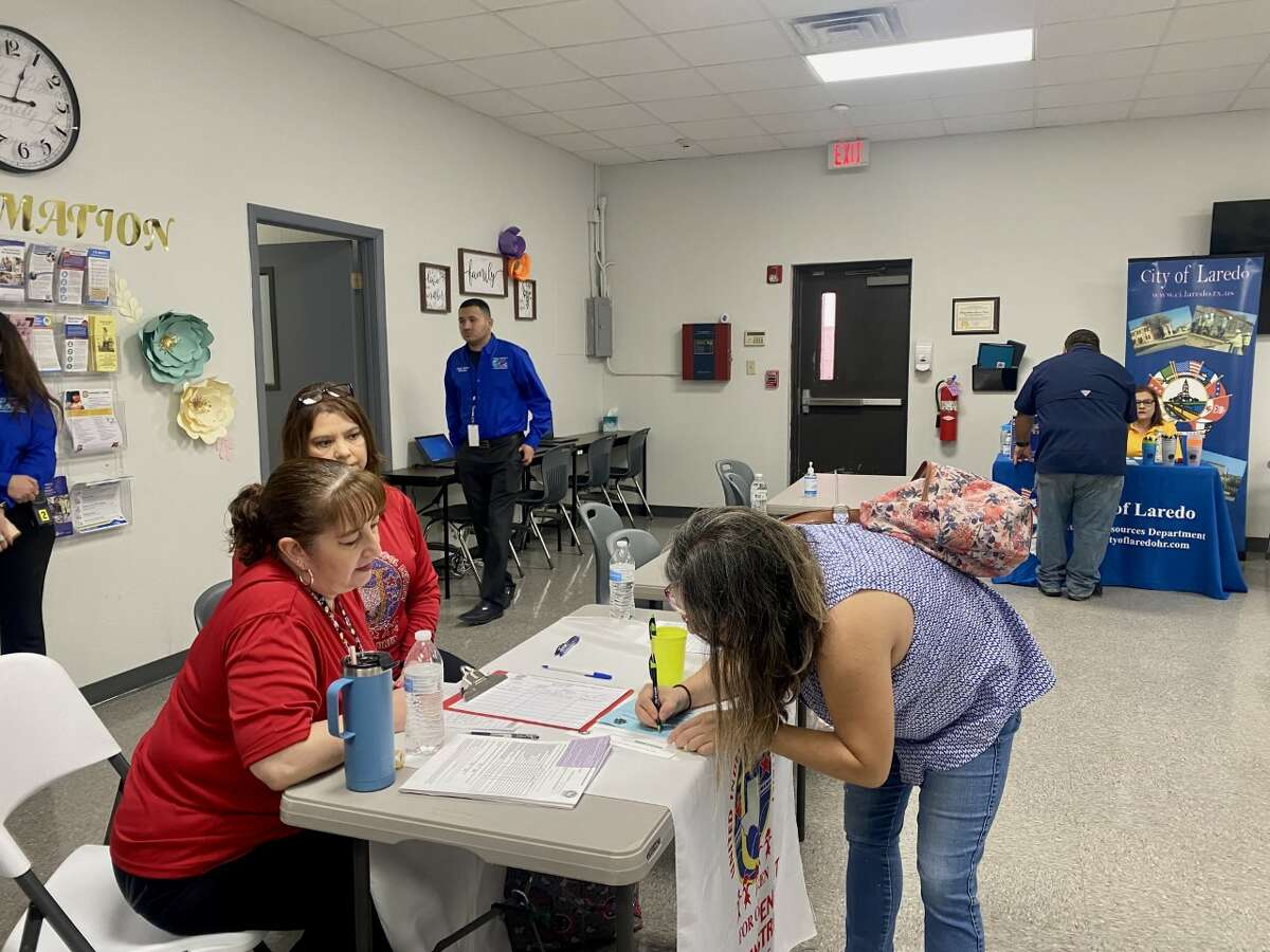 Karla Cervantes, fills up an application during the job fair 'Spring Forward to a New Job!' at the Family Matters Resource Center on Wednesday, Mar. 22, 2023.