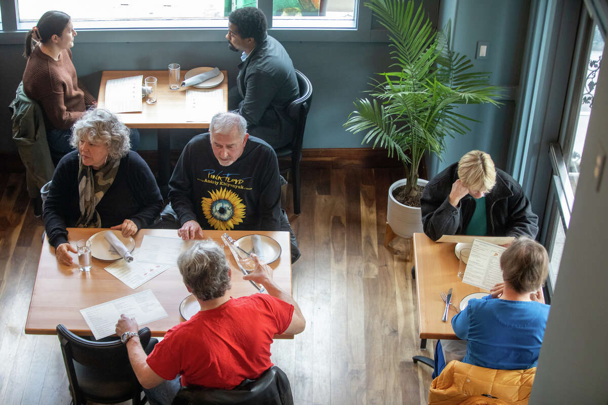 Customers sit down inside Pizzeria da Laura in Berkeley, Calif. on March 23, 2023.