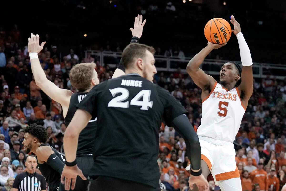 University of Texas basketball Longhorns laughing all the way