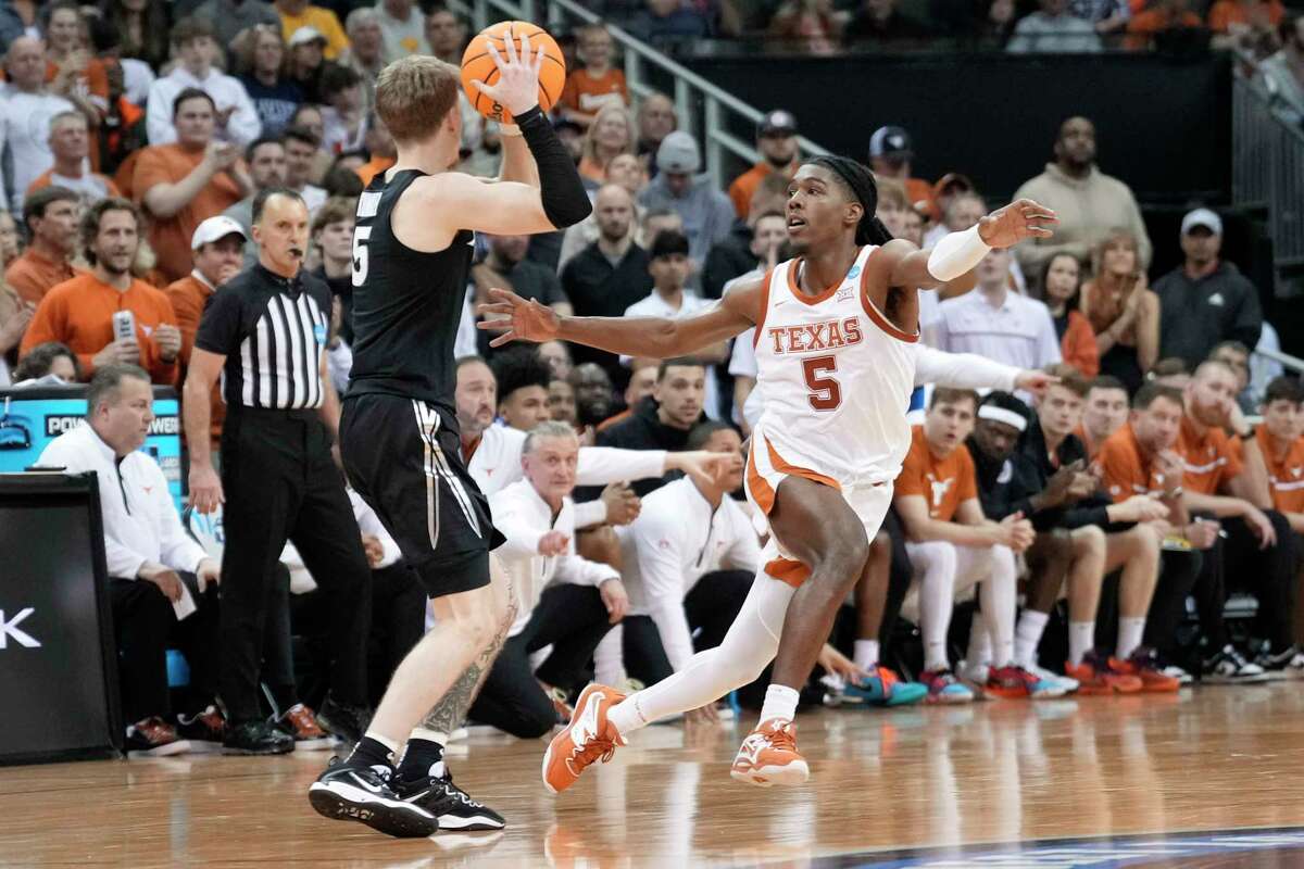 University of Texas basketball Longhorns laughing all the way