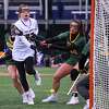 UAlbany senior Sarah Falk scores a goal in front of Vermont defender Brittany Barton during an America East game on Saturday, March 25, 2023, at John Fallon Field on the UAlbany campus in Albany, NY.
