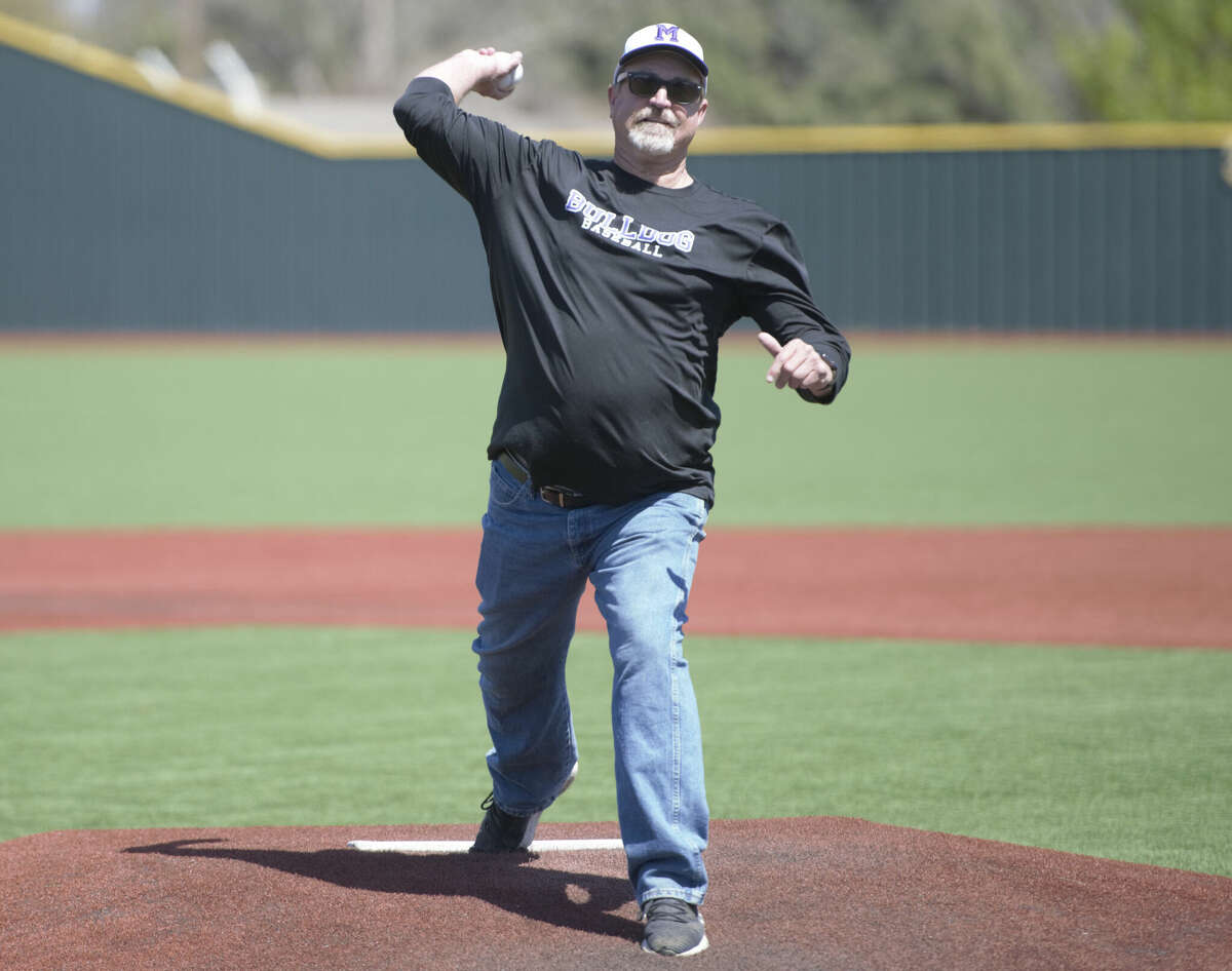 Texas High School Baseball Coaches Association Hall of Famer Barry Russell throws out the ceremonial first pitch on Barry Russell Day before the Midland High vs. San Angelo Central game, March 25 at Zachery Field. 