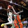 Acade’Mie guard Lansana Nwosu defends a shot from Patroons guard Trevis Wyche during a game at Washington Ave Armory in Albany, N.Y., Saturday, Mar. 25, 2023. (Jenn March, Special to the Times Union)