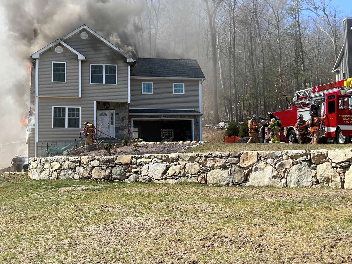 Firefighter taken to hospital after battling Brookfield blaze