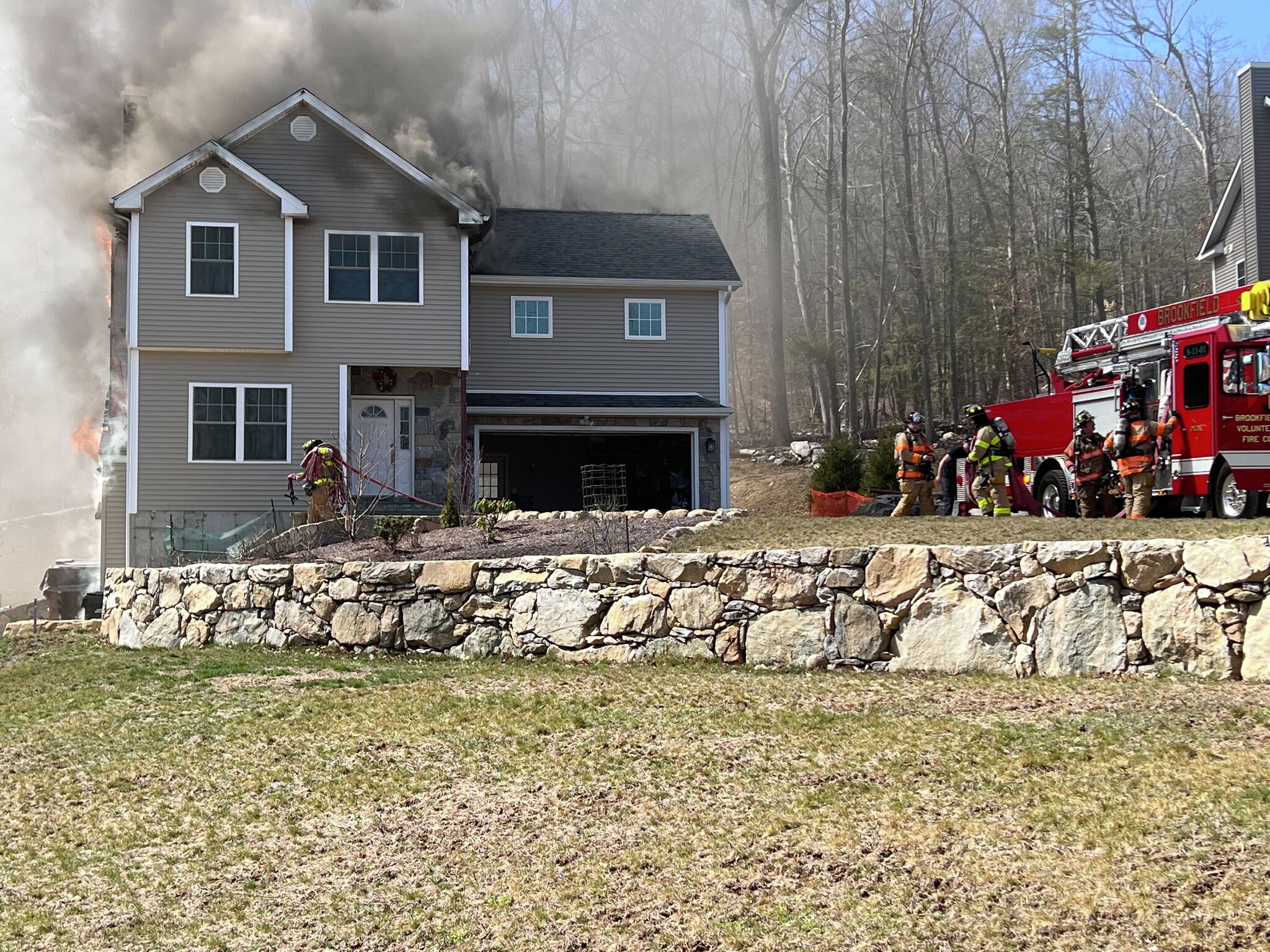 Firefighter taken to hospital after battling Brookfield blaze
