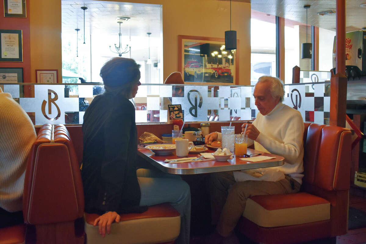 Barbara Sharp and Ted Lang enjoy breakfast and conversation at Bob's Big Boy in Burbank, Calif.