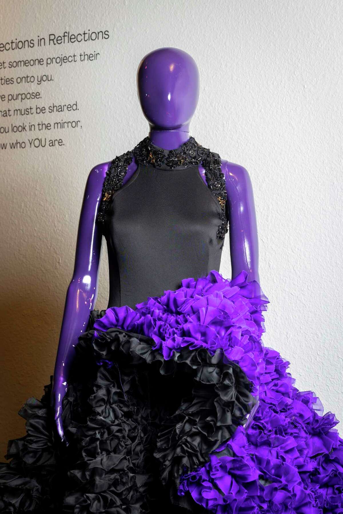 Mannequins clothed in Chasity Sereal’s wearable art stand on display at the Harris County Cultural Arts Council on Monday, March 27, 2023. The fashion exhibit, titled “Growing Pains: A Wearable Art Experience,” features 10 pieces from Sereal.