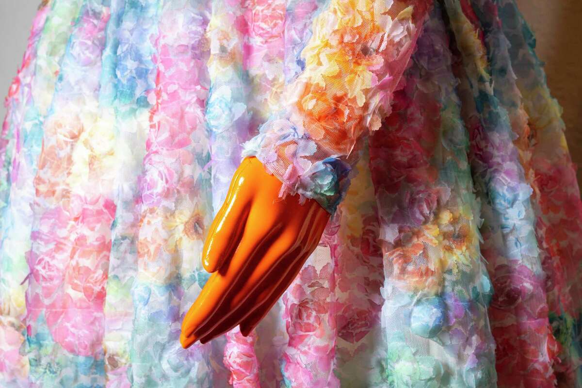 A detail of a color flower sleeve in Chasity Sereal’s wearable art stand on display at the Harris County Cultural Arts Council on Monday, March 27, 2023. The fashion exhibit, titled “Growing Pains: A Wearable Art Experience,” features 10 pieces from Sereal.