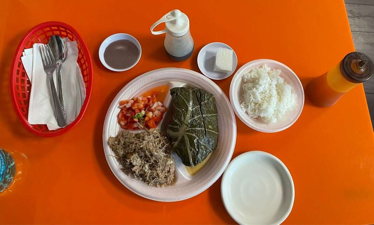 Lau lau is a classic Hawaiian dish of salty pork and butterfish wrapped in taro and ti leaves.