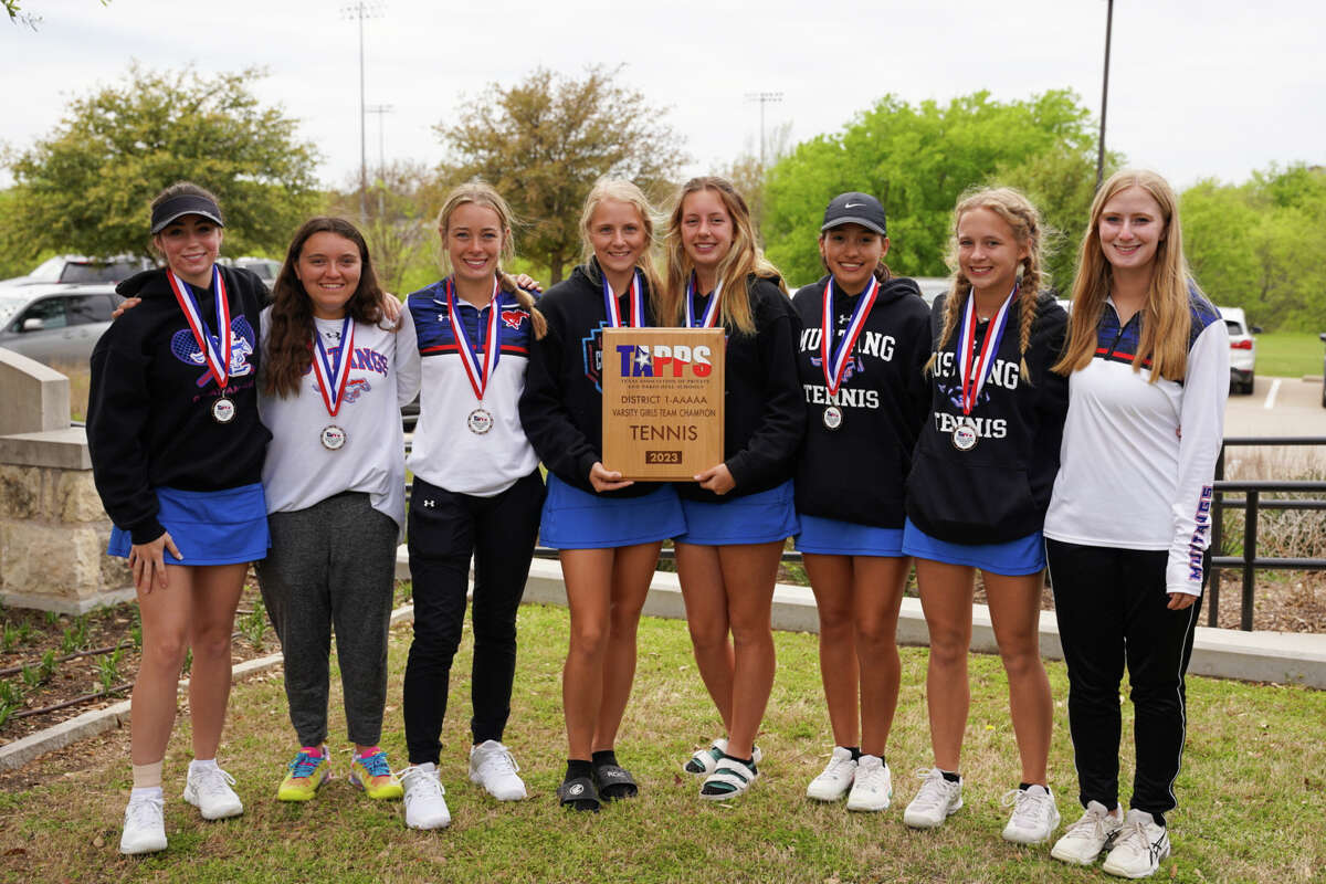 The Midland Christian girls tennis team holds the TAPPS 1-5A title plaque after winning the district championship, March 29 at Fort Worth All Saints Episcopal School 