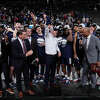 UConn head coach Dan Hurley, middle, celebrates with his team after the 82-54 win against Gonzaga of an Elite 8 college basketball game in the West Region final of the NCAA Tournament, Saturday, March 25, 2023, in Las Vegas. (AP Photo/John Locher)
