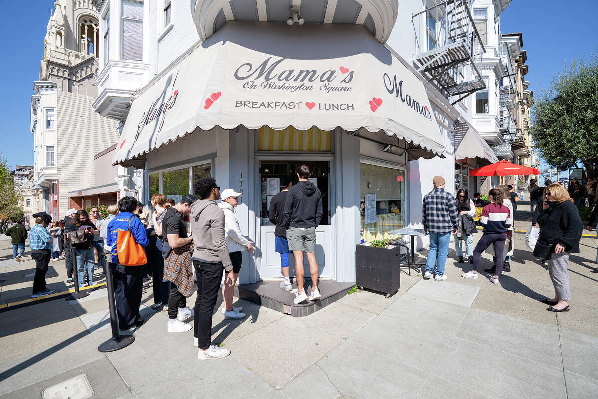 Customers wait in line and order at the front door for Mama's On Washington Square in San Francisco, Calif. on March 25, 2023.