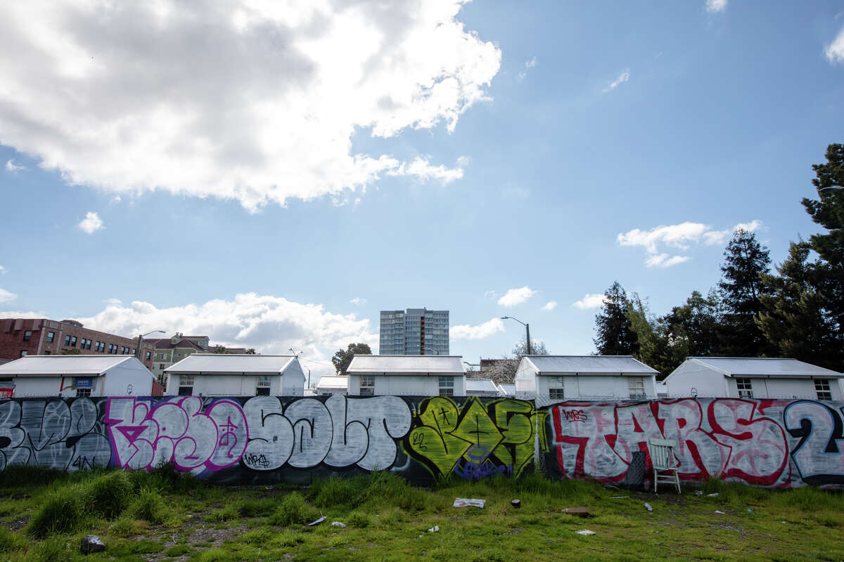 A group of tiny home shelters for homeless people at the corner on East 12th Street near Lake Merritt in Oakland, Calif., on March 30, 2023.