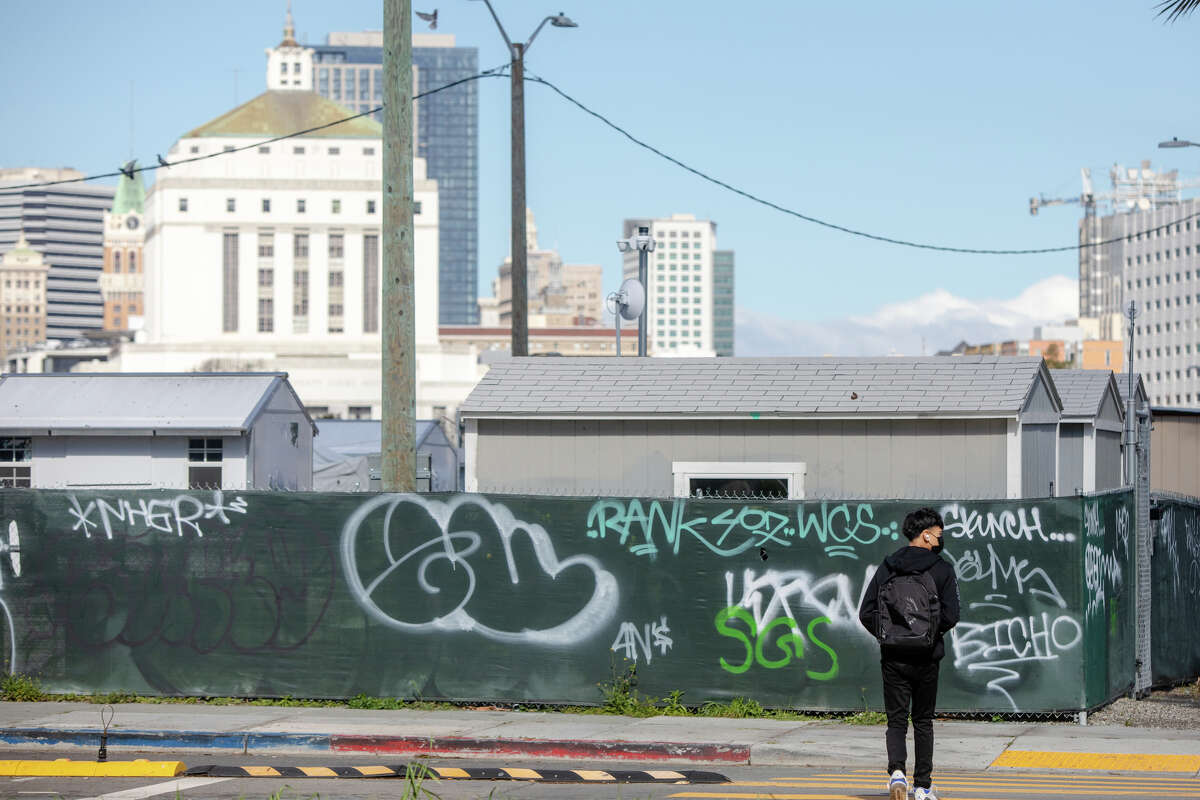 A group of tiny-home shelters for homeless people at the corner on E.12th Street near Lake Merritt in Oakland, Calif. on Mar. 30, 2023.