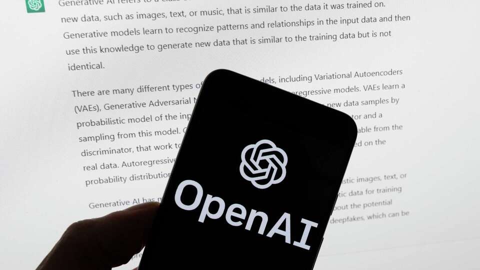 FILE - The OpenAI logo is seen on a mobile phone in front of a computer screen displaying output from ChatGPT, Tuesday, March 21, 2023, in Boston. Are tech companies moving too fast in rolling out powerful artificial intelligence technology that could one day outsmart humans? That is the conclusion of a group of prominent computer scientists and other tech industry notables who are calling for a 6-month pause to consider the risks. Their petition published Wednesday, March 29, 2023, is a response to San Francisco startup OpenAI's recent release of GPT-4. (AP Photo/Michael Dwyer, File)