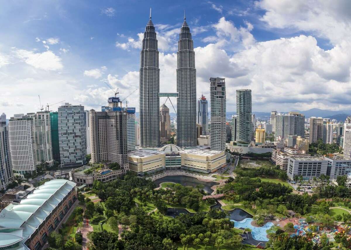 #12. Malaysia - Cost index: 61.2% cheaper than the U.S. - Exchange rate: 4.52 Malaysian ringgits to $1 - Region: Southeast Asia Bordering Brunei, which came in at #16 on this list, Malaysia offers affordable tourist experiences. Kuala Lumpur features big city attractions like the tallest twin towers in the world, a sky bridge, and the family-friendly Sunway Lagoon Theme Park. The 400-million-year-old Tempurung Cave in Gopeng, Perak, provides more adventurous travelers with guided tours lasting up to 3.5 hours for $5 or less. The Rainforest Discovery Centre in Sabah is another popular natural attraction, with trails weaved through the jungle and a steel canopy walkway suspended 82 feet, perfect for birdwatching.