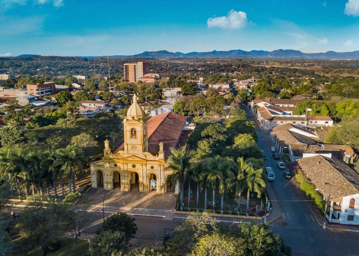 #11. Paraguay - Cost index: 61.4% cheaper than the U.S. - Exchange rate: 7,200 Paraguayan guaranis to $1 - Region: South America Although it may not have as many flashy attractions as the surrounding countries of Argentina, Brazil, and Bolivia, Paraguay is just as rich in South American history and culture. The Museo Jesuítica de Santa Fe highlights local Jesuit history through religious carvings, and the Panteón de los Héroes holds the remains of key historical figures. Those seeking a unique experience can arrange private trips to see the flamingos of Chaco Lodge during the dry season for less than $14 per vehicle, and visitors can even camp on the nature reserve. You may also like: US airlines most likely to bump passengers