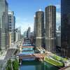 Looking west down the main branch of the Chicago River featuring the two identical residential towers of Marina City, which opened in 1963.