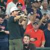 Mark Wahlberg points to Houston Astros third baseman Alex Bregman to tell him happy birthday during the Play Ball call before the start of the first inning on opening day of an MLB baseball game at Minute Maid Park on Thursday, March 30, 2023 in Houston.