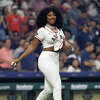 HOUSTON, TEXAS - MARCH 30: Megan Thee Stallion throws oiut the first pitch as the Houston Astros play the Chicago White Sox on Opening Day at Minute Maid Park on March 30, 2023 in Houston, Texas. (Photo by Bob Levey/Getty Images)