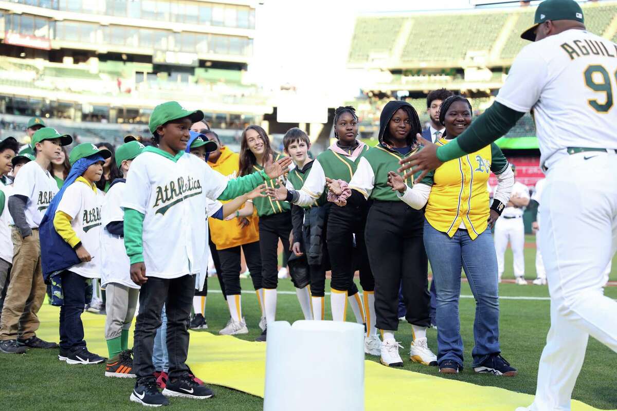 Oakland A's rally late to beat Angels in opener