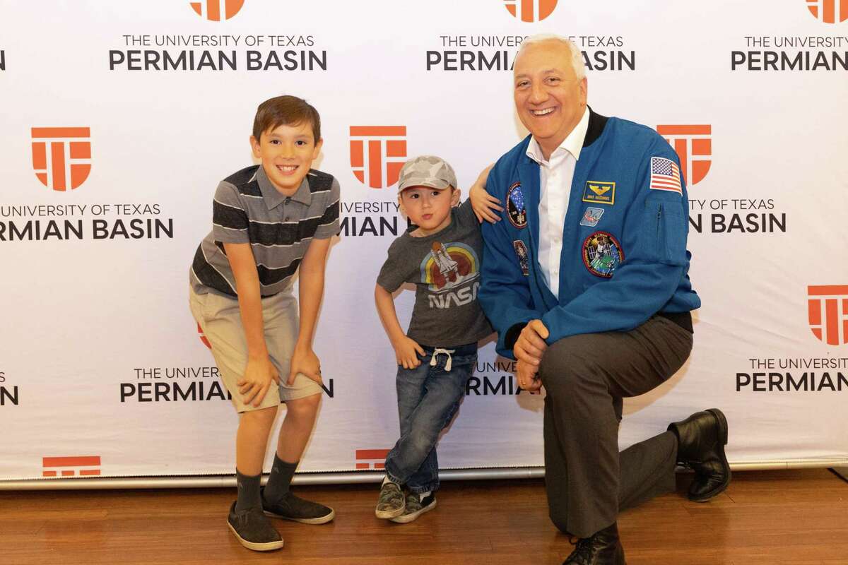 Oliver Shedd, age 4 and Jacob Shedd, age 9, meet Mike Massimino, former NASA Astronaut and New York Times bestselling author, at the Wagner Noel Performing Arts Center March 30, 2023 as part of the University of Texas Permian Basin Distinguished Lecture Series. Photo Credit: The Oilfield Photographer, Inc.