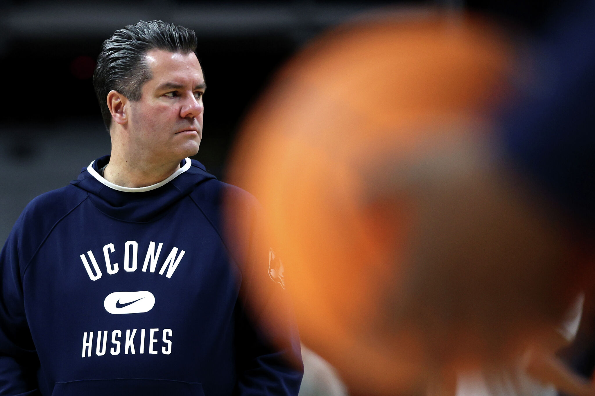 UConn assistant Tom Moore bridges Hurley, Calhoun eras