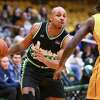 Albany Patroons guard Shadell Millinghaus drives to the basket in front of London guard Marcus Ottey during a game on Friday, March 31, 2023, at The Armory in Albany, NY.