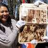 Mayor London Breed holds a copy of The San Francisco Chronicle pulled out of a nearly century-year-old time capsule during its unearthing at Mt. Davidson in San Francisco, Calif., on Saturday, April 1, 2023. A time capsule is planned to take its place.