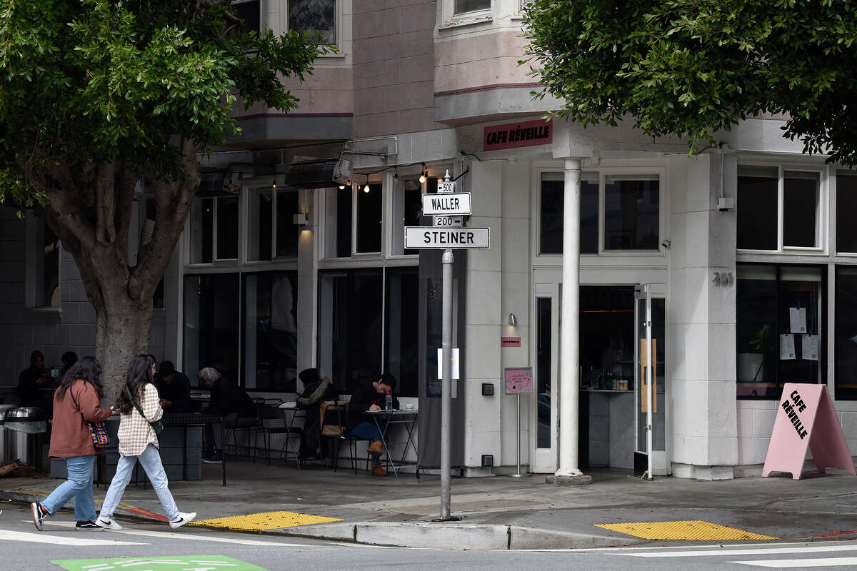 Customers sit outside along Waller Street at Cafe Reveille in the Lower Haight, on Thursday, March 30, 2023.