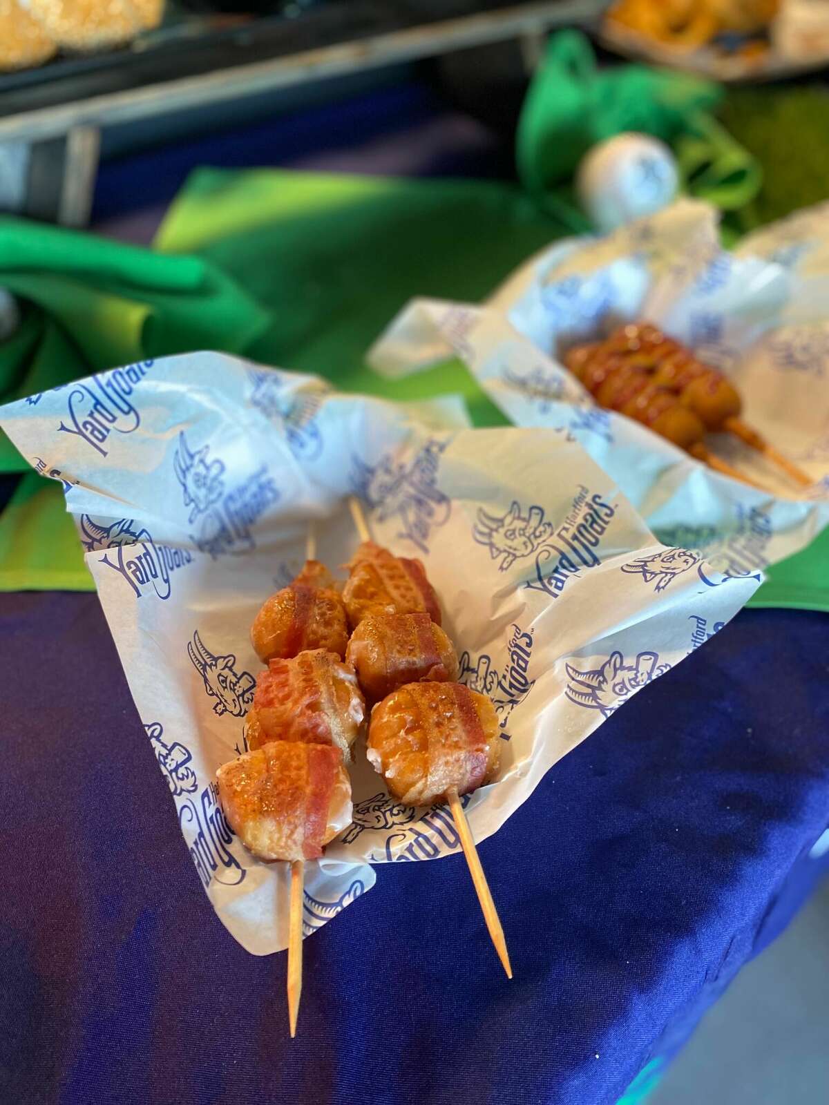 Bacon-wrapped Munchkins are among the returning snacks at Dunkin' Park this season.