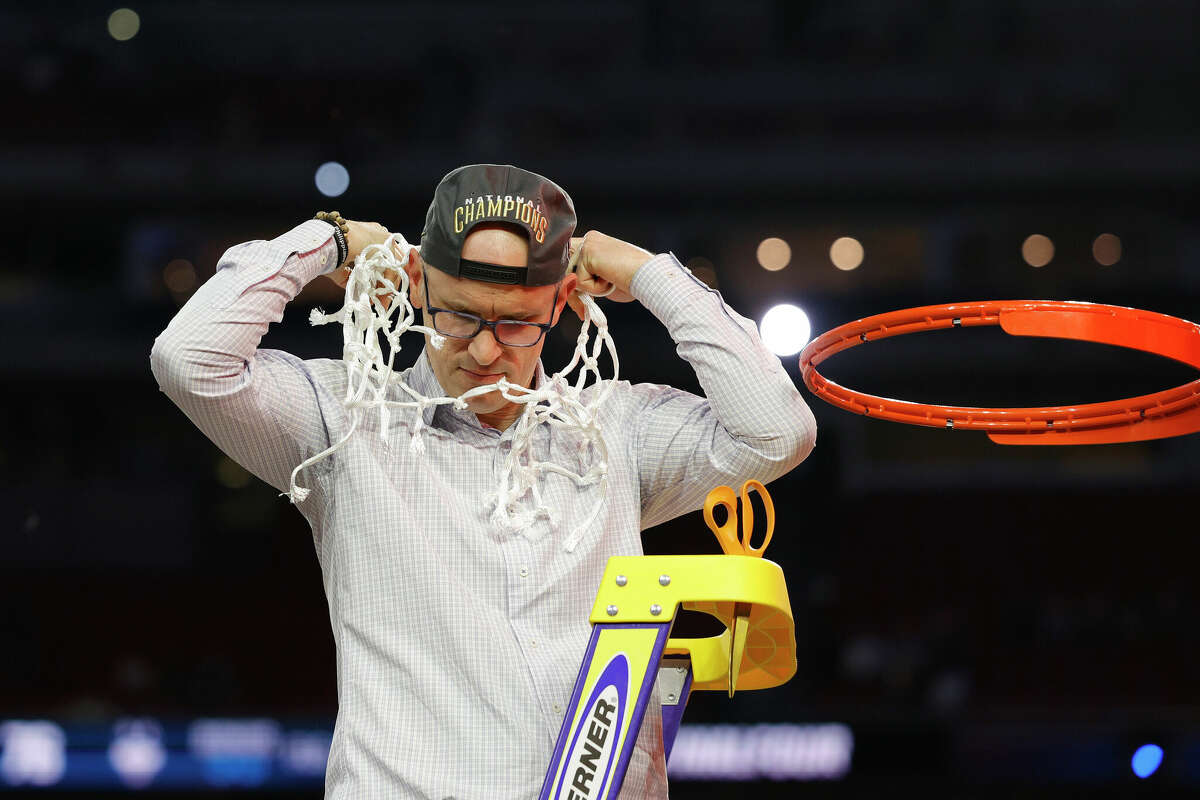 HOUSTON, TEXAS - APRIL 03: Head coach Dan Hurley of the Connecticut Huskies reacts as he cuts down the net after defeating the San Diego State Aztecs 76-59 during the NCAA Men's Basketball Tournament National Championship game at NRG Stadium on April 03, 2023 in Houston, Texas. (Photo by Carmen Mandato/Getty Images)