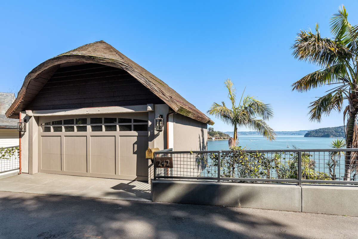 Fairytale cottage clinging to Belvedere Island hillside for sale