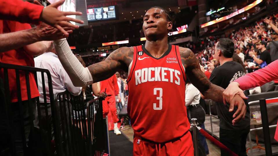 Houston Rockets guard Kevin Porter Jr. (3) shakes hands with fans after the Rockets defeated the Denver Nuggets 124-103 in their last home game of the season at the Toyota Center on Tuesday, April 4, 2023.