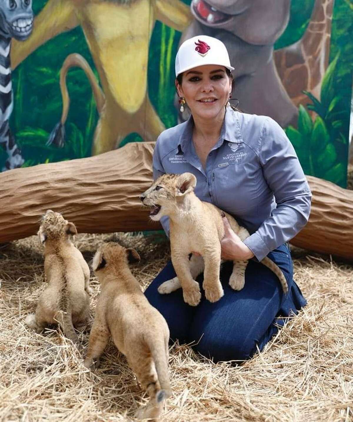 Nuevo Laredo Mayor Carmen Lilia Canturosas is pictured with three lion cubs born in late February 2023 at Zoológico Regional de Nuevo Laredo.