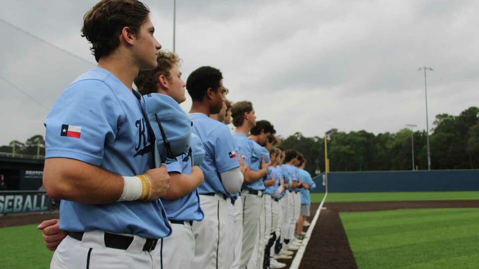 The Kingwood baseball team during the national anthem before a District 21-6A game against Summer Creek at Andy Wells Field.