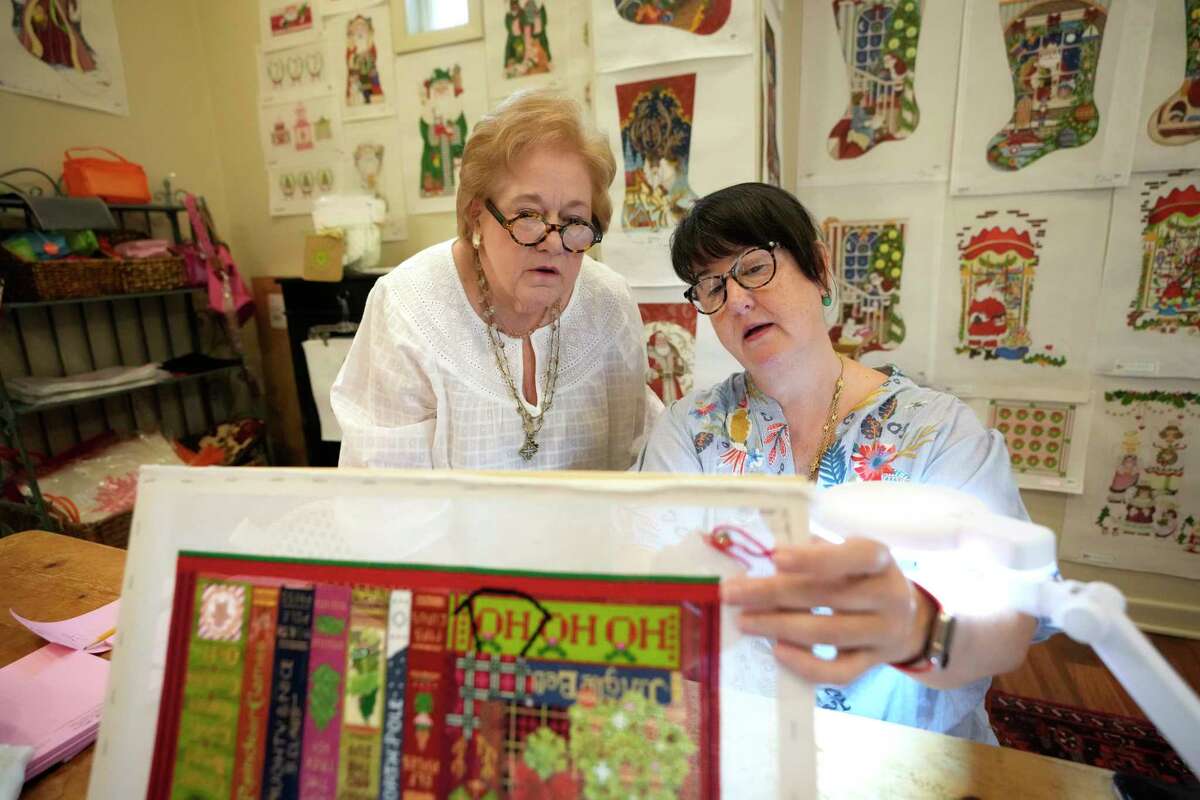 Nancy Laux, owner of Needle House, 2422 Tangley Rd., left, works with Elisa Shatto, right, during a class Wednesday, April 5, 2023, in Houston.