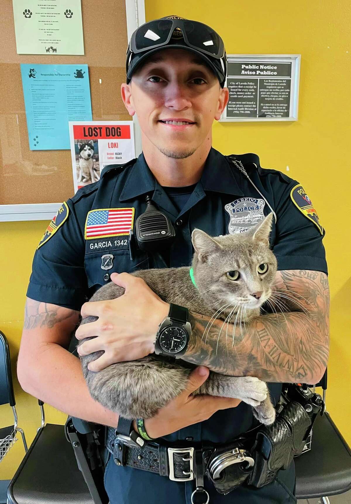 Officer C. Garcia from the Laredo Police Department is pictured with Greyson, a 3-year-old cat up for adoption through Laredo Animal Care Services.