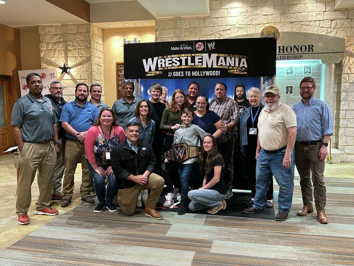 JJ with his family, Make-A-Wish and Del Papa Distributing Company staff members celebrating him going to WrestleMania