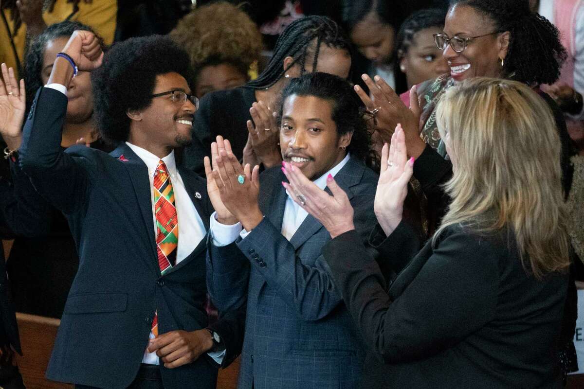 Expelled Rep. Justin Pearson, D-Memphis, from left, expelled Rep. Justin Jones, D-Nashville, and Rep. Gloria Johnson, D-Knoxville, are recognized by the audience at Fisk University before Vice President Kamala Harris arrives, Friday, April 7, 2023, in Nashville, Tenn.