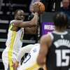 Golden State Warriors forward Draymond Green (23) grabs a rebound during the first quarter of his NBA basketball game against the Sacramento Kings in Sacramento, Calif. Friday, April 7, 2023.
